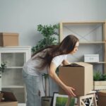 woman with boxes in house