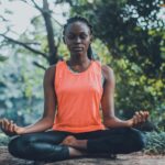 woman meditating in the outdoors